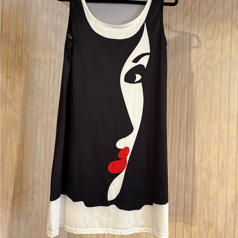 Stylish Black and White Dress with Artistic Face Design